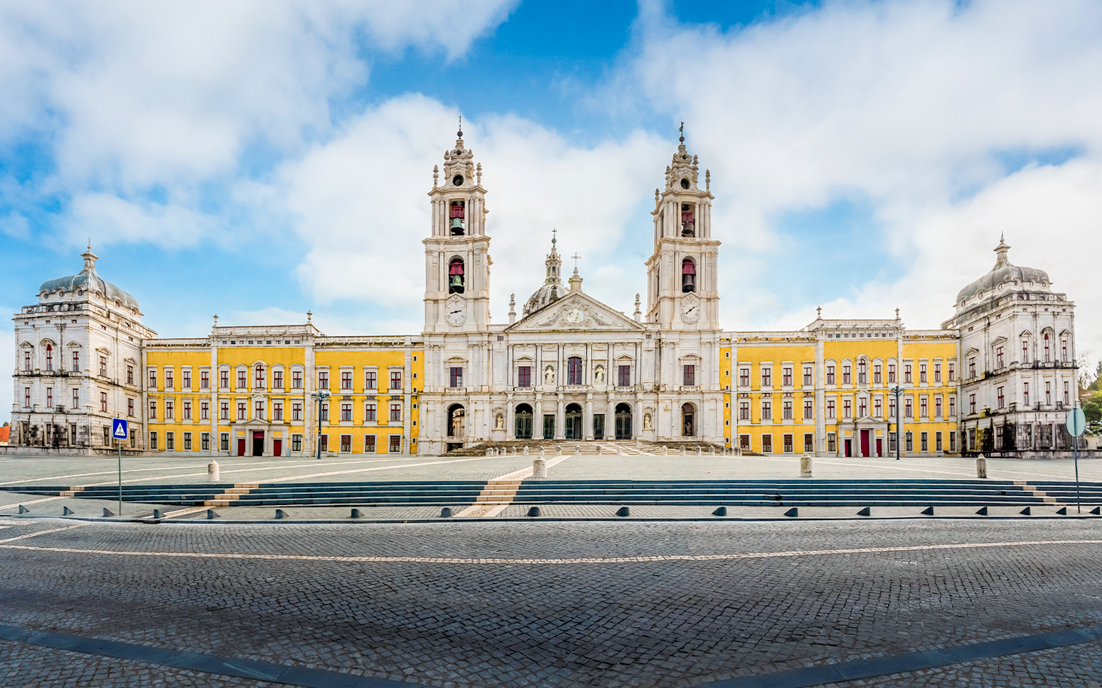 Palace of Mafra facade with twin bell towers, Mafra, Portugal.