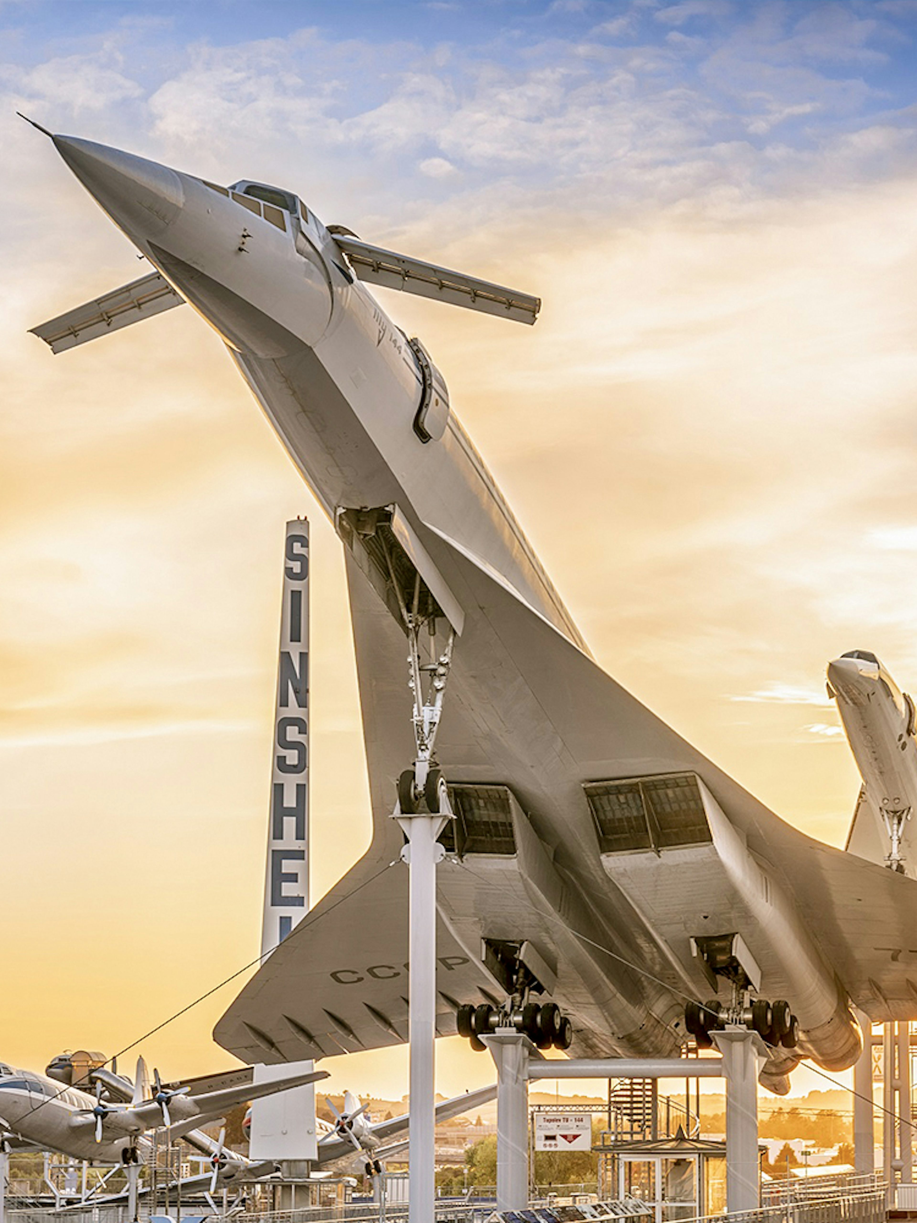 Airplane display at Technik Museum Sinsheim during sunset.