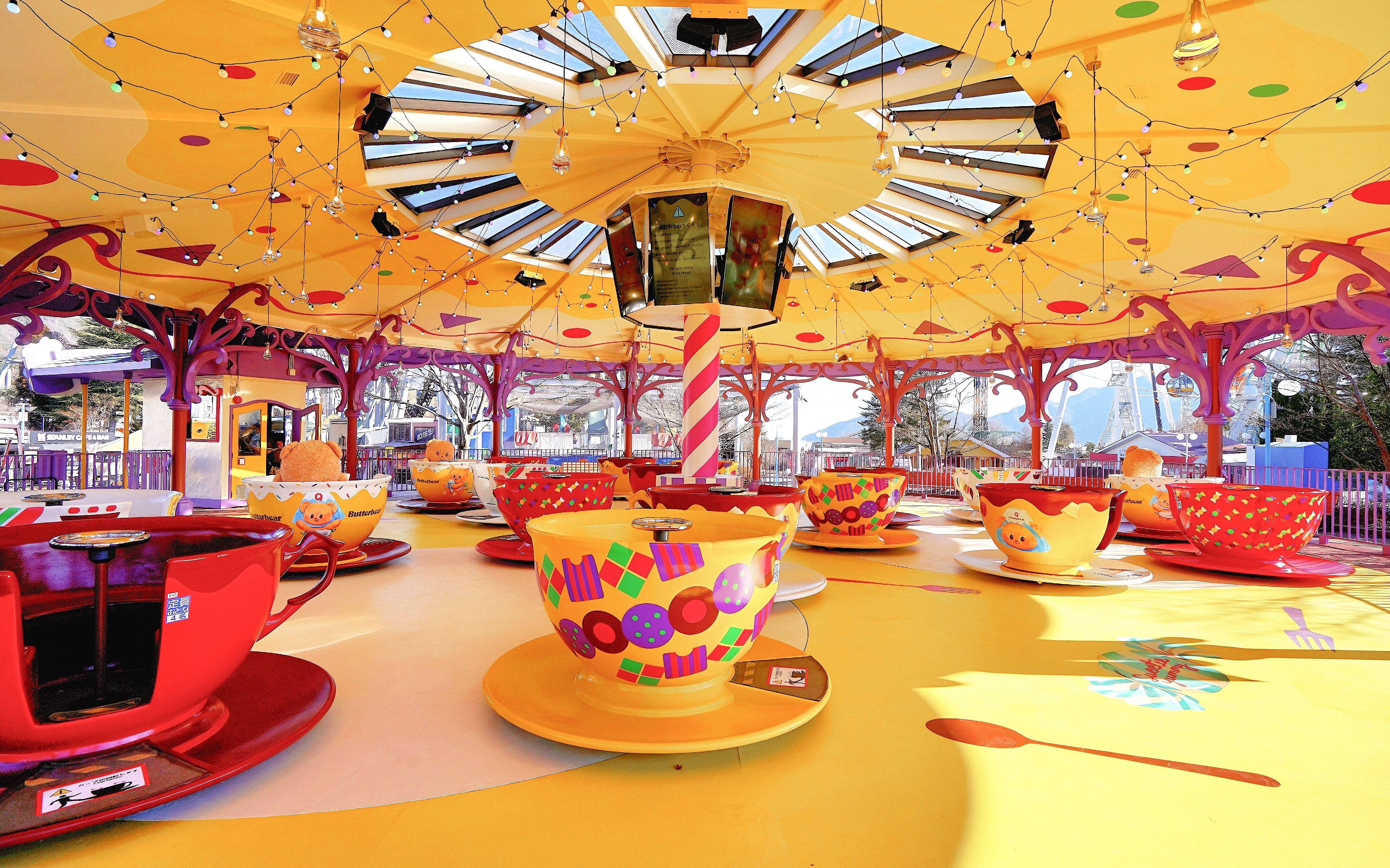 B.Duck themed teacups ride at Fuji-Q Highland, Japan, with colorful teacups and festive decor.