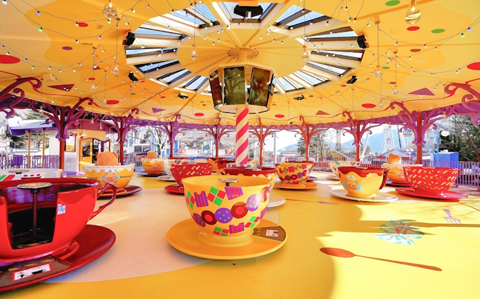 B.Duck themed teacups ride at Fuji-Q Highland, Japan, with colorful teacups and festive decor.
