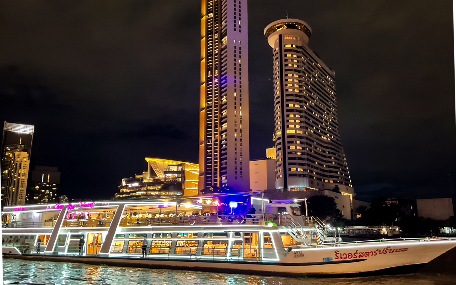River Star Princess cruise on Chao Phraya River with Bangkok skyline at night.