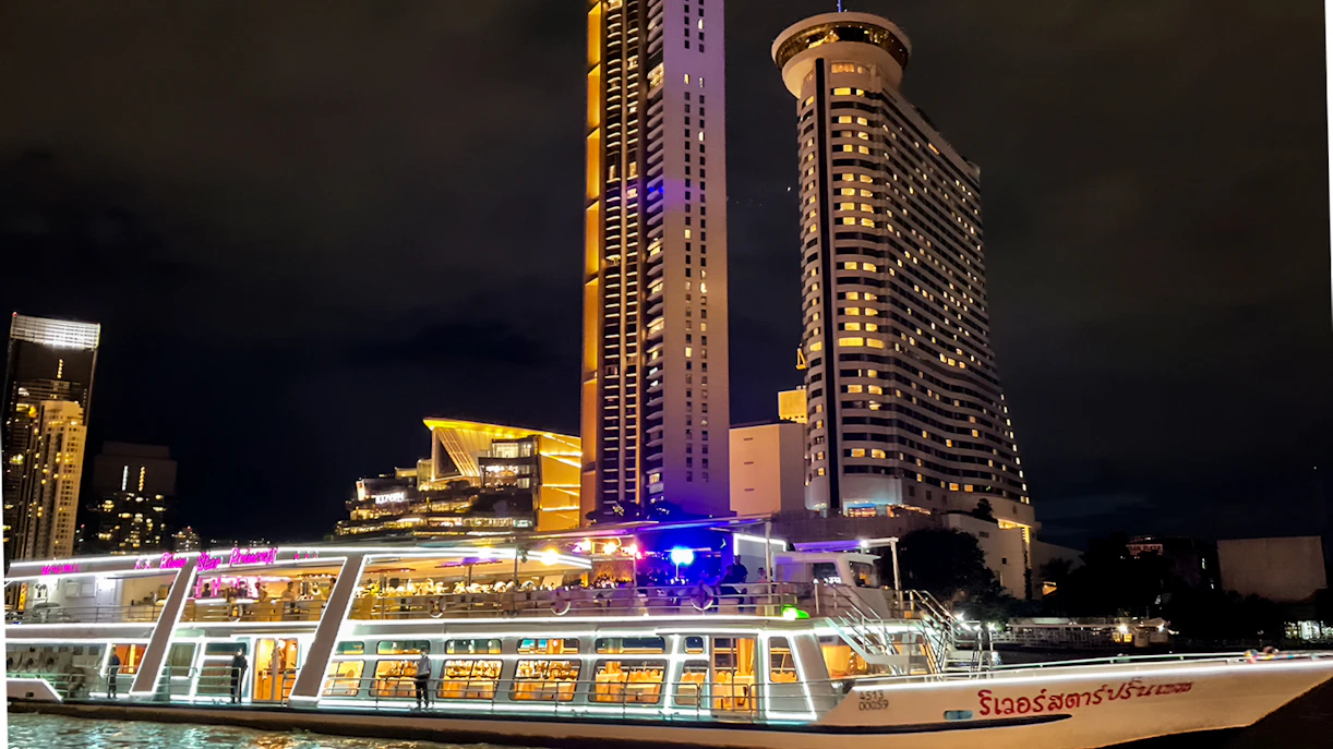 River Star Princess cruise on Chao Phraya River with Bangkok skyline at night.