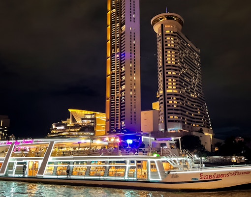 River Star Princess cruise on Chao Phraya River with Bangkok skyline at night.