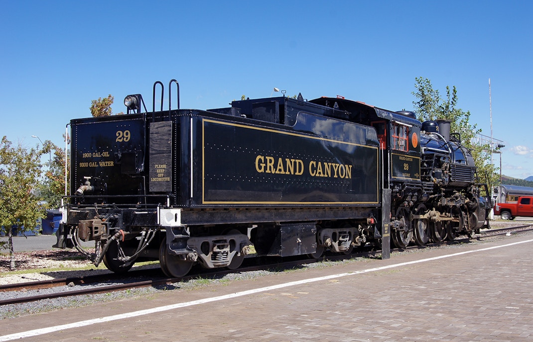 Grand Canyon Railway train traveling through Arizona desert landscape.
