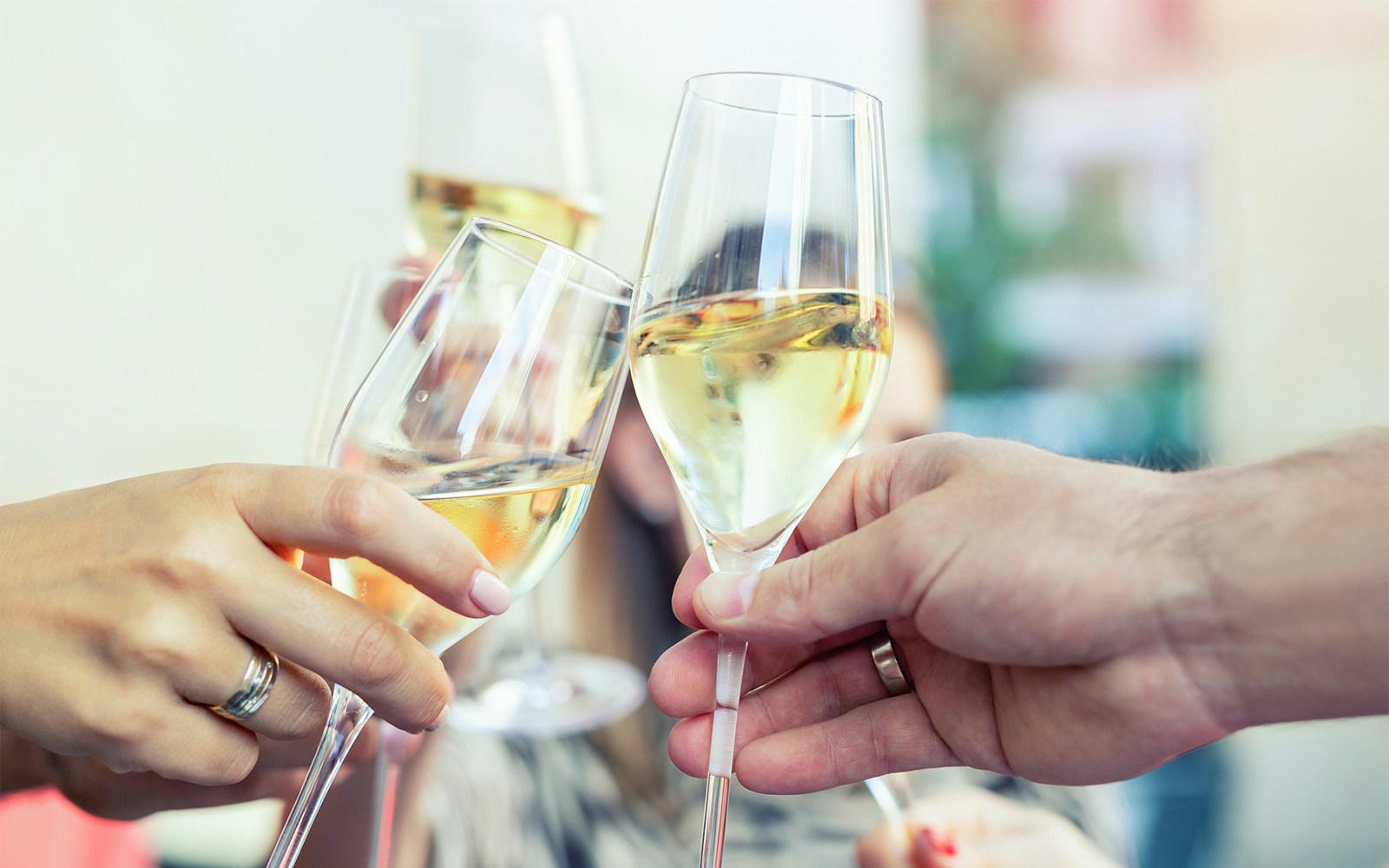 Guests toasting with prosecco on Budapest evening cruise.
