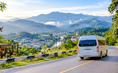 Private van on a scenic mountain road from Chiang Mai to Mae Hong Son Town.
