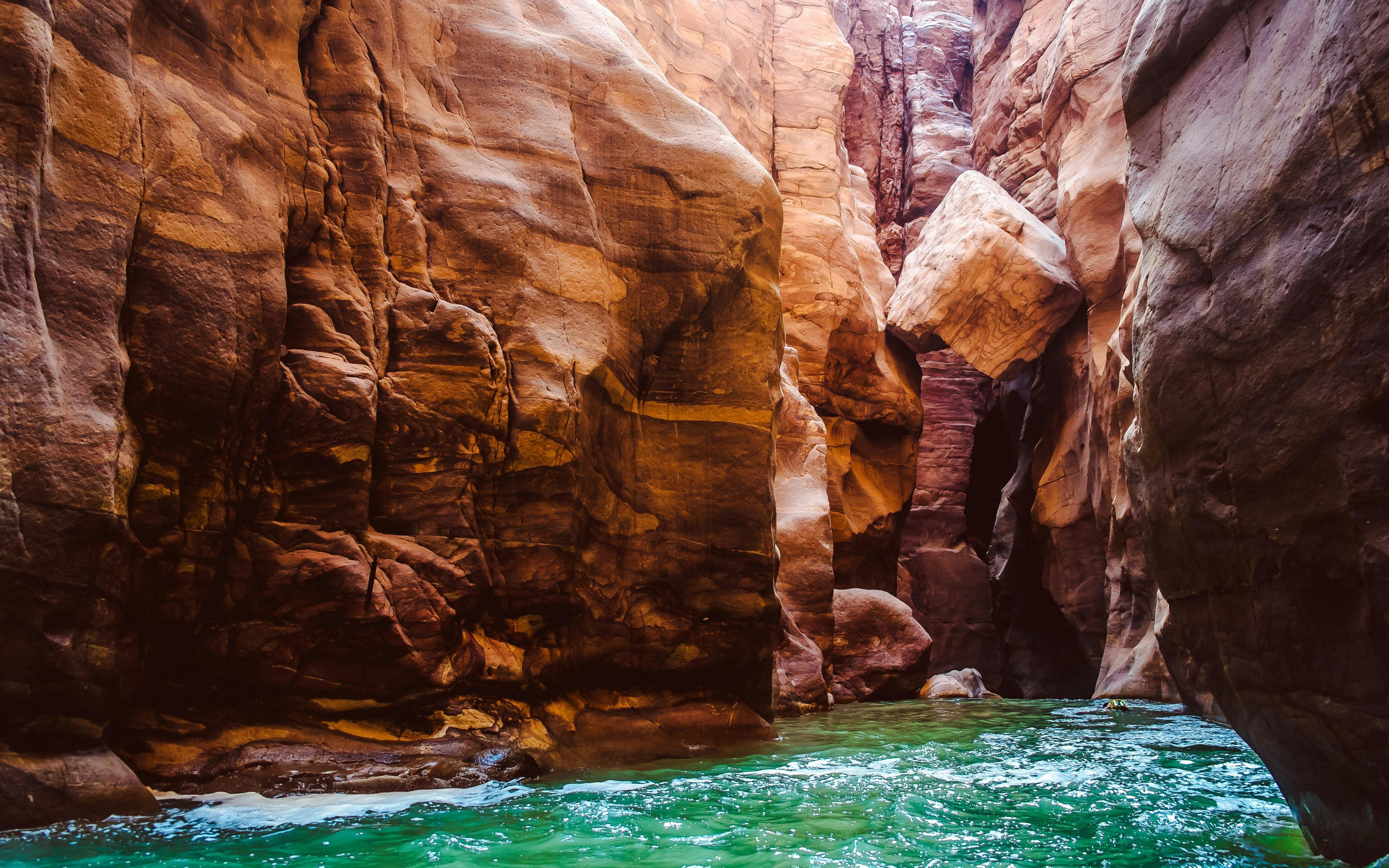 Canyon walls and flowing water at Mujib Reserve, Wadi Mujib, Jordan.