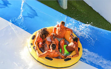 Group enjoying a raft ride at Aquafan Water Park.
