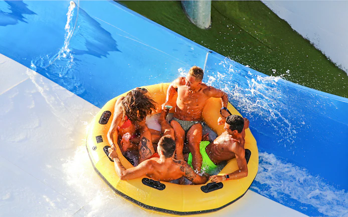 Group enjoying a raft ride at Aquafan Water Park.