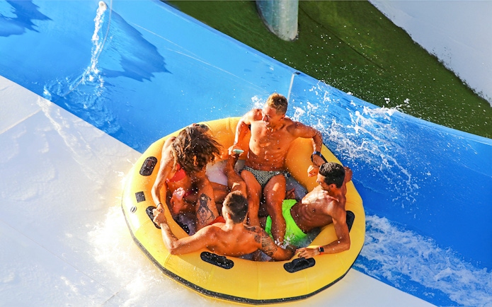 Group enjoying a raft ride at Aquafan Water Park.