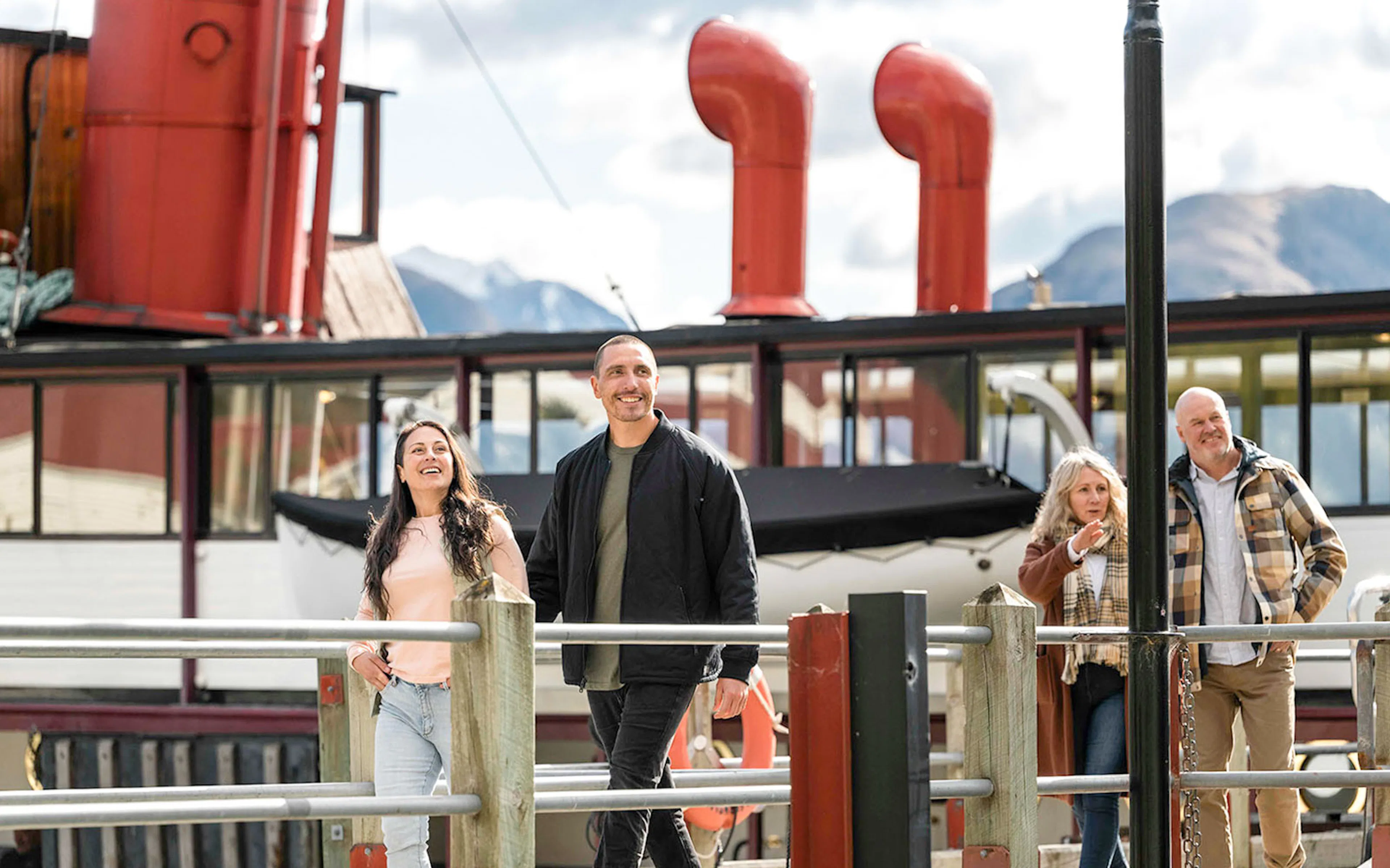 Tourist approaching TSS Earnslaw Cruise on Lake Wakatipu, Queenstown, New Zealand.