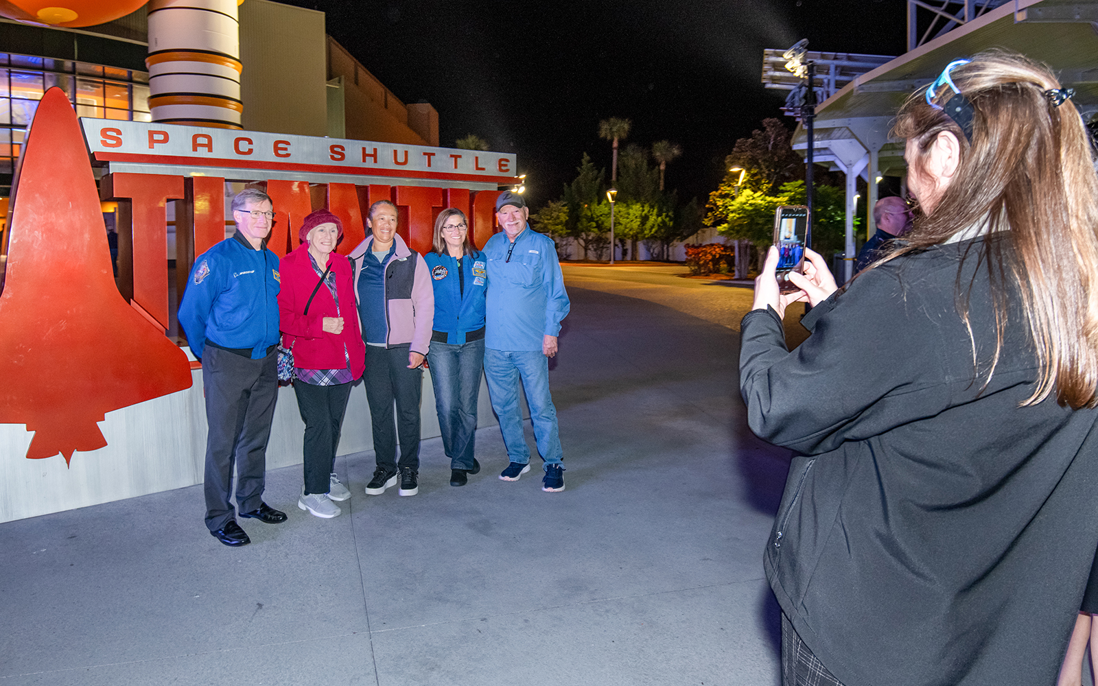  Visitors in front of the The Deep Space Launch Complex