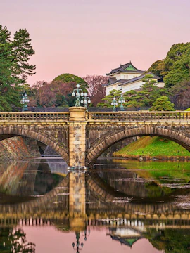 Imperial Palace bridge over moat at sunset, Tokyo, Japan.