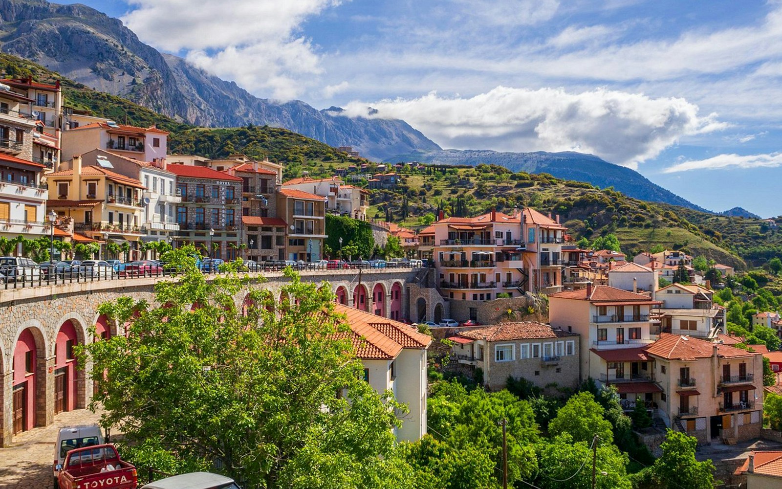 Arachova Greece landscape with traditional houses and mountains in the background.