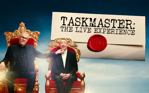 Taskmasters the Live Experience promotional image with two men on ornate chairs