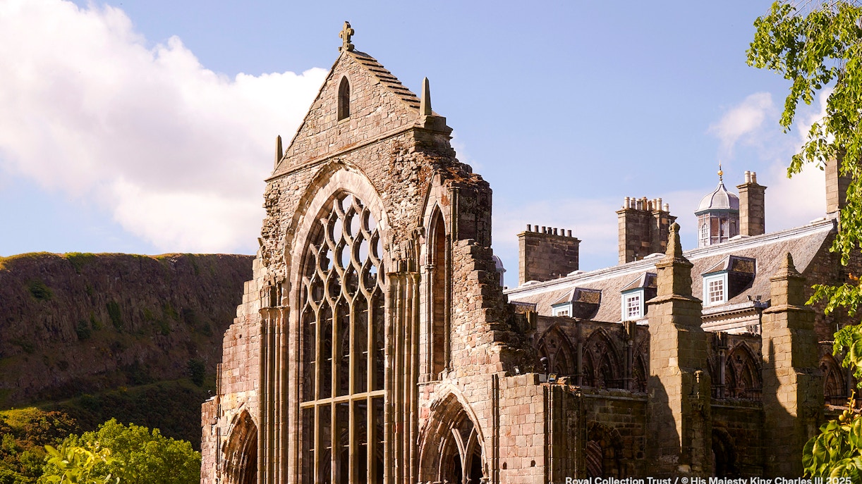 Holyrood Abbey ruins at the Palace of Holyroodhouse, Edinburgh, with Arthur's Seat in the background.