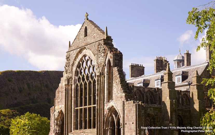 Holyrood Abbey ruins at the Palace of Holyroodhouse, Edinburgh, with Arthur's Seat in the background.