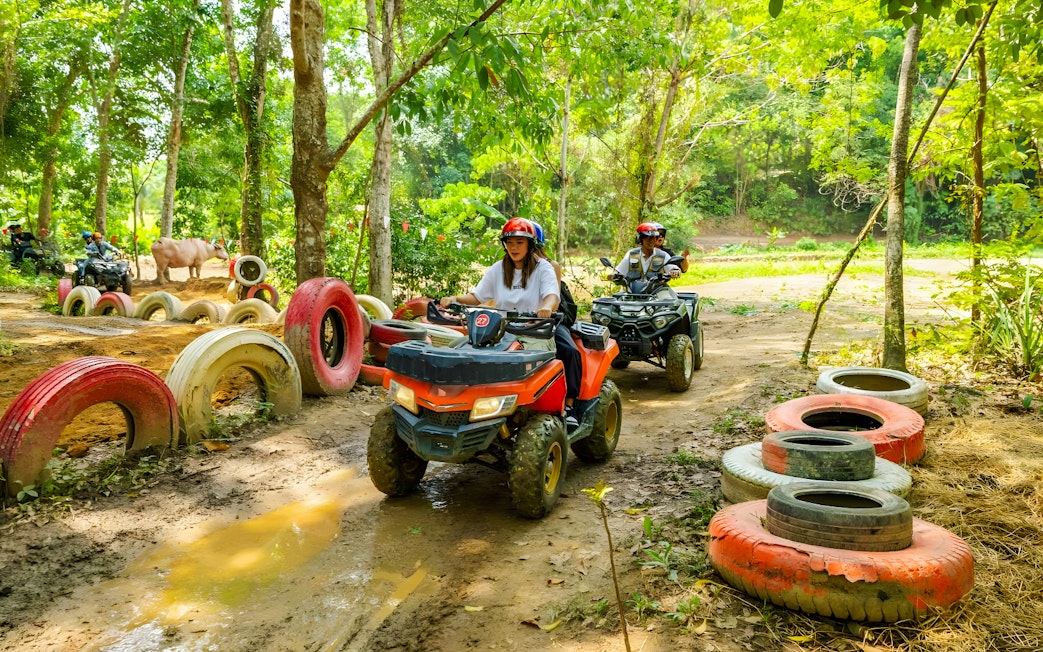 Quad biking through forest trail at Flying Hanuman, Phuket.