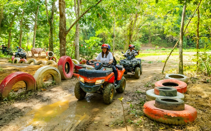 Quad biking through forest trail at Flying Hanuman, Phuket.