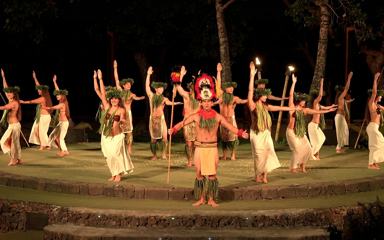 Traditional Hawaiian dancers performing at Old Lahaina Luau in Maui.