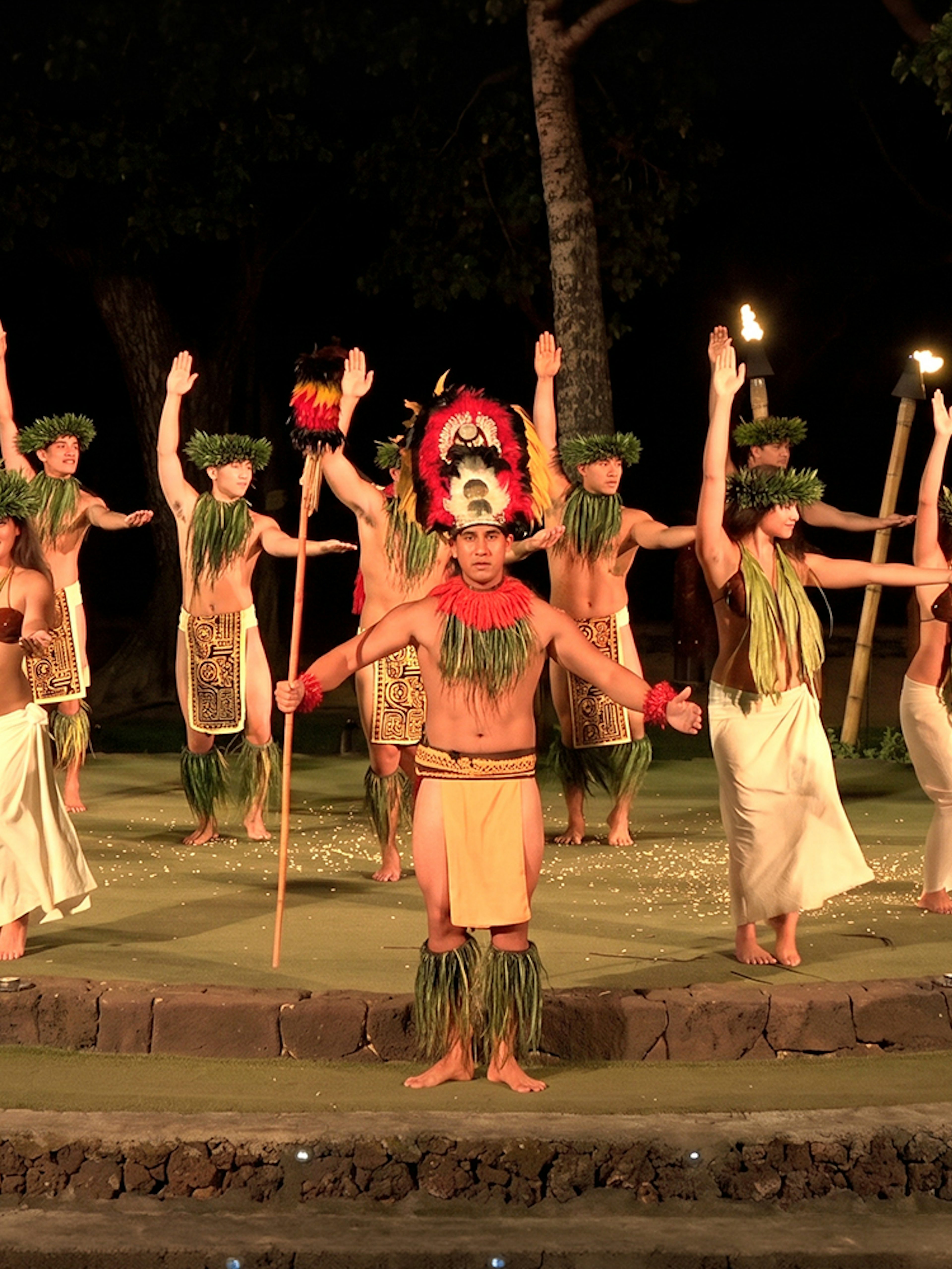 Traditional Hawaiian dancers performing at Old Lahaina Luau in Maui.