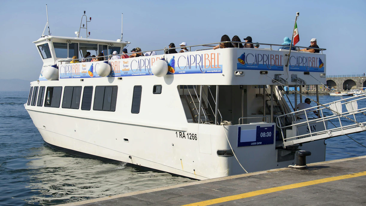 Cruise passengers disembarking at Amalfi Coast pier.