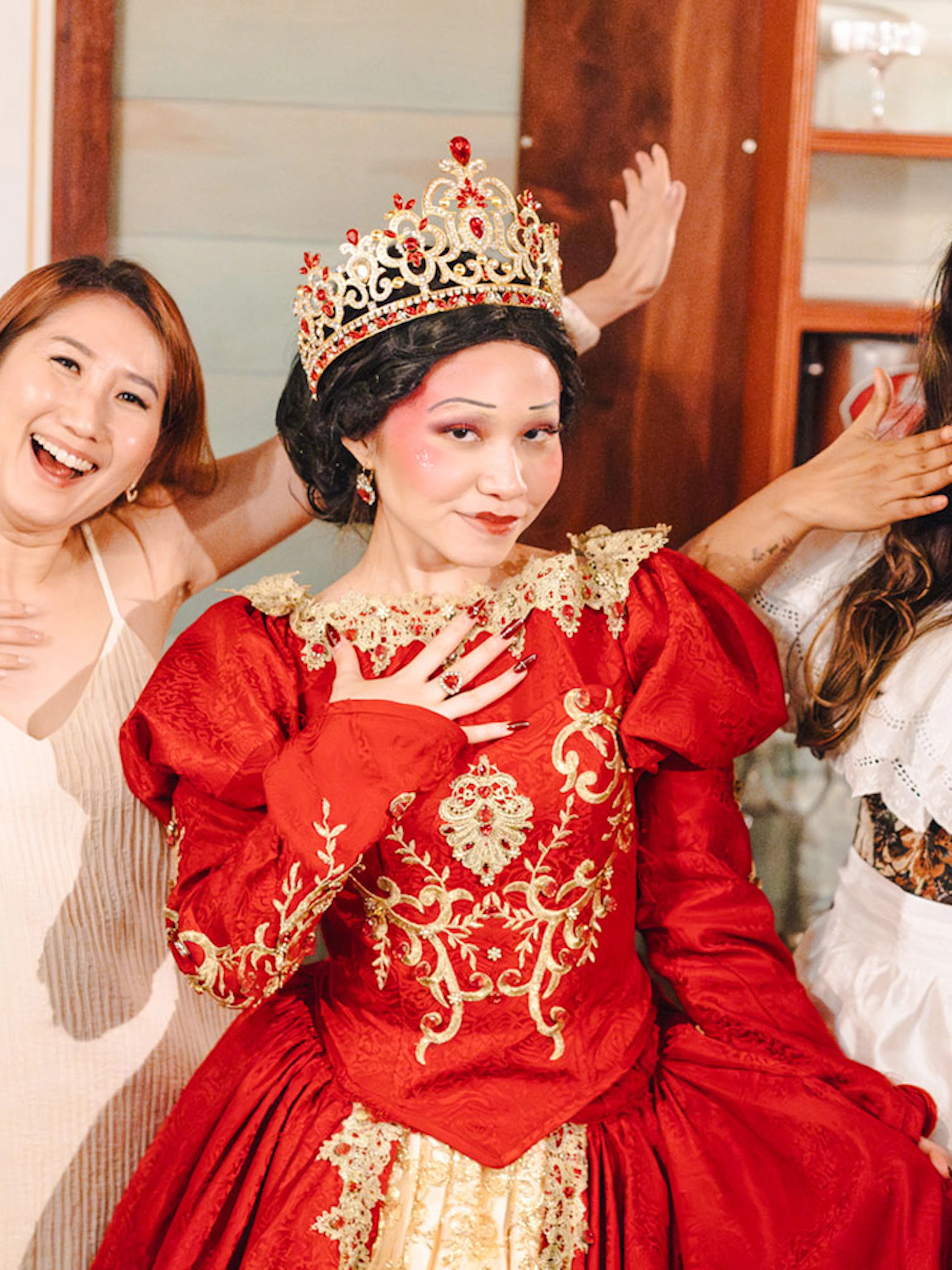 Guests with Queen of Hearts at Wonderland Upside Down experience.