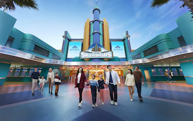 Visitors walking at the entrance of Genting SkyWorlds theme park.