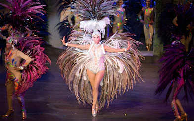 Performer in elaborate costume at Colosseum Show Pattaya.
