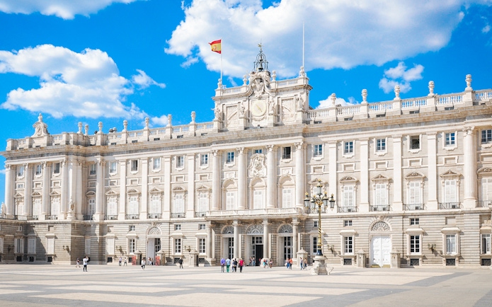 Tourists at the Royal Palace of Madrid courtyard, Spain, with skip-the-line access.