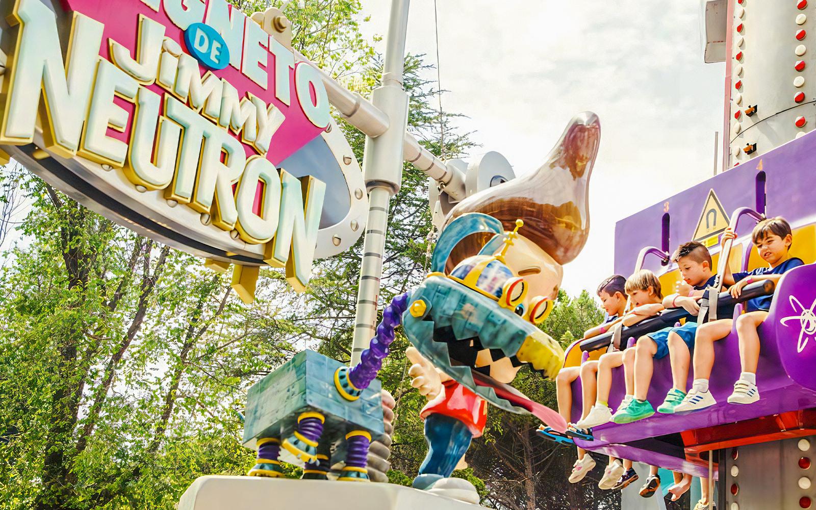 Jimmy Neutron's Magneto ride at Parque De Atracciones De Madrid with vibrant coaster tracks.