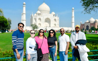 Group of tourists in front of the Taj Mahal during Agra tour.