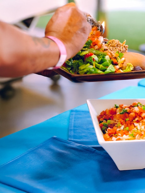Serving traditional Hawaiian dishes at Moana Luau, Hawaii.