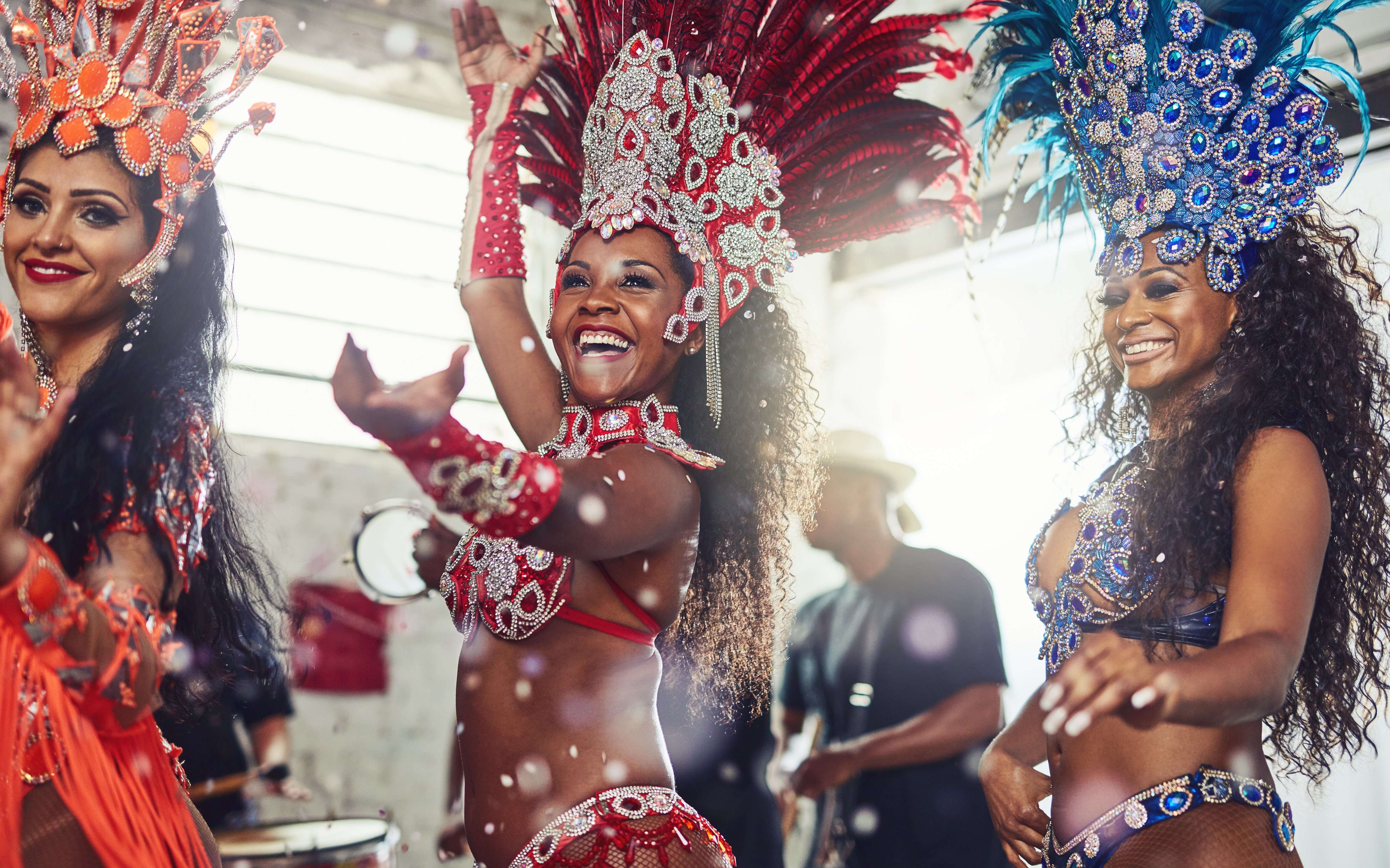 Samba dancers in vibrant costumes performing at a carnival.