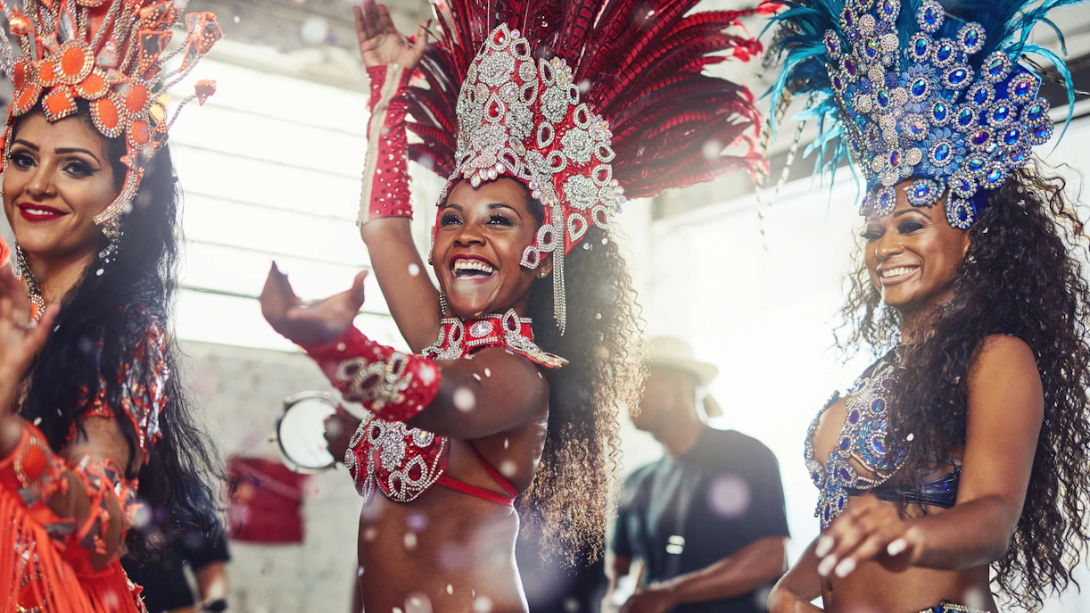 Samba dancers in vibrant costumes performing at a carnival.