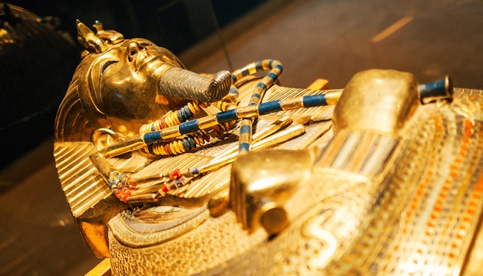 Ancient Egyptian artifacts displayed in Neues Museum exhibit.