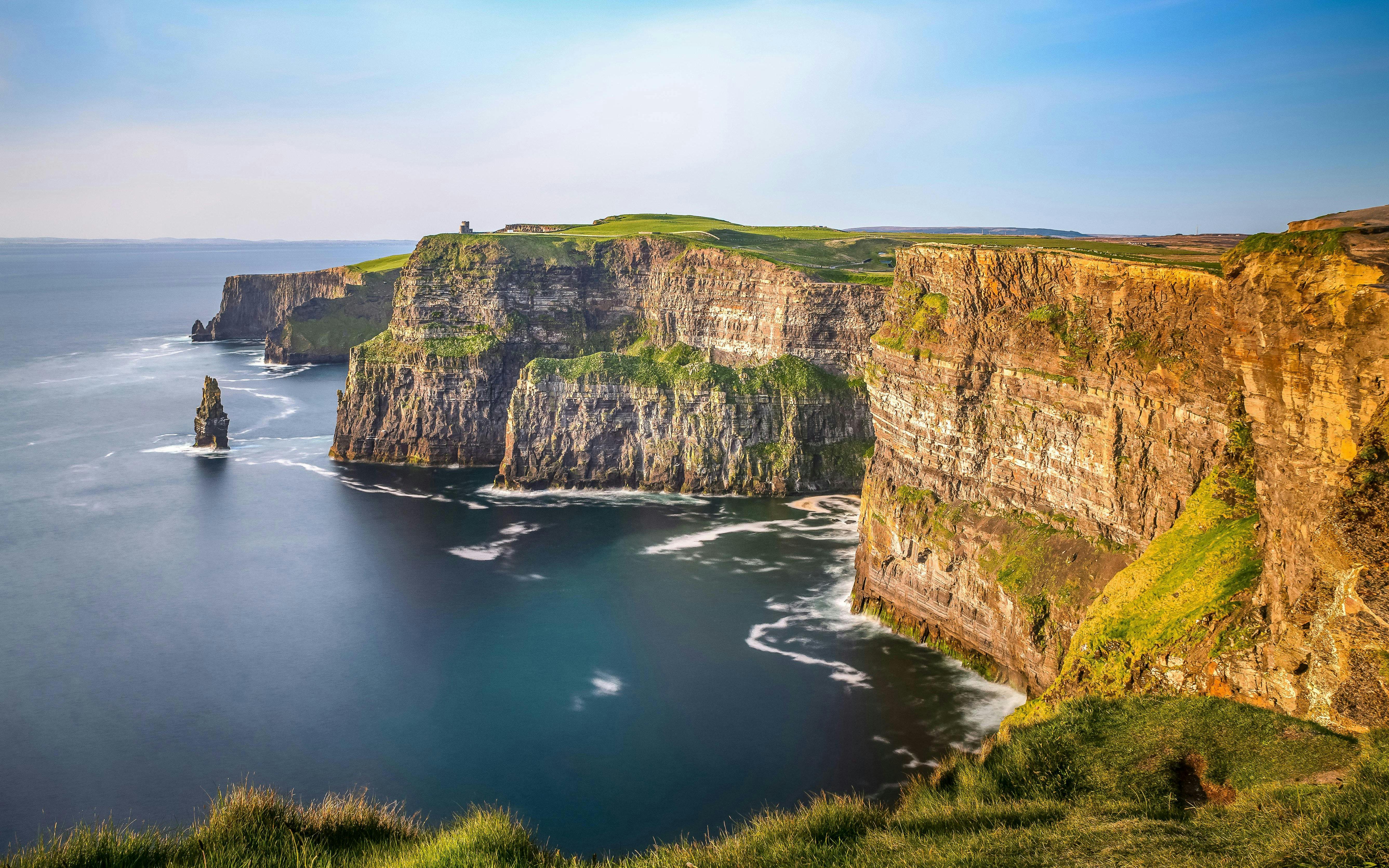 Cliffs of Moher, Ireland, with rugged cliffs and ocean view.
