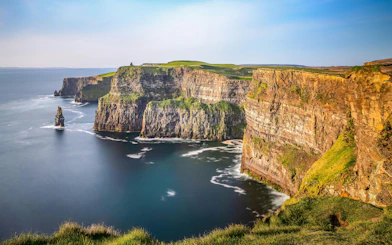 Cliffs of Moher, Ireland, with rugged cliffs and ocean view.