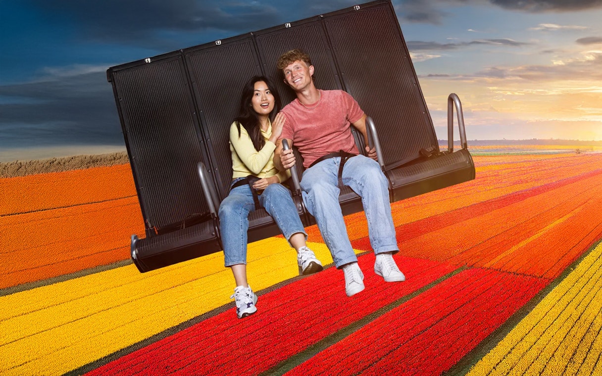 Guests enjoying the 5D Ultimate Flight Experience over vibrant tulip fields.