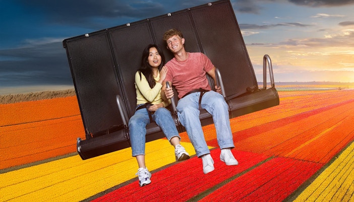 Guests enjoying the 5D Ultimate Flight Experience in a dynamic simulator ride.