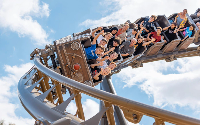 Roller coaster with riders at Drayton Manor theme park.
