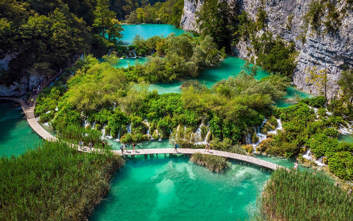 Aerial view of Plitvice Lakes with wooden walkways and turquoise water during a private day tour from Split.