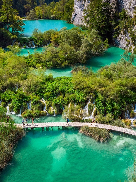 Aerial view of Plitvice Lakes with wooden walkways and turquoise water during a private day tour from Split.