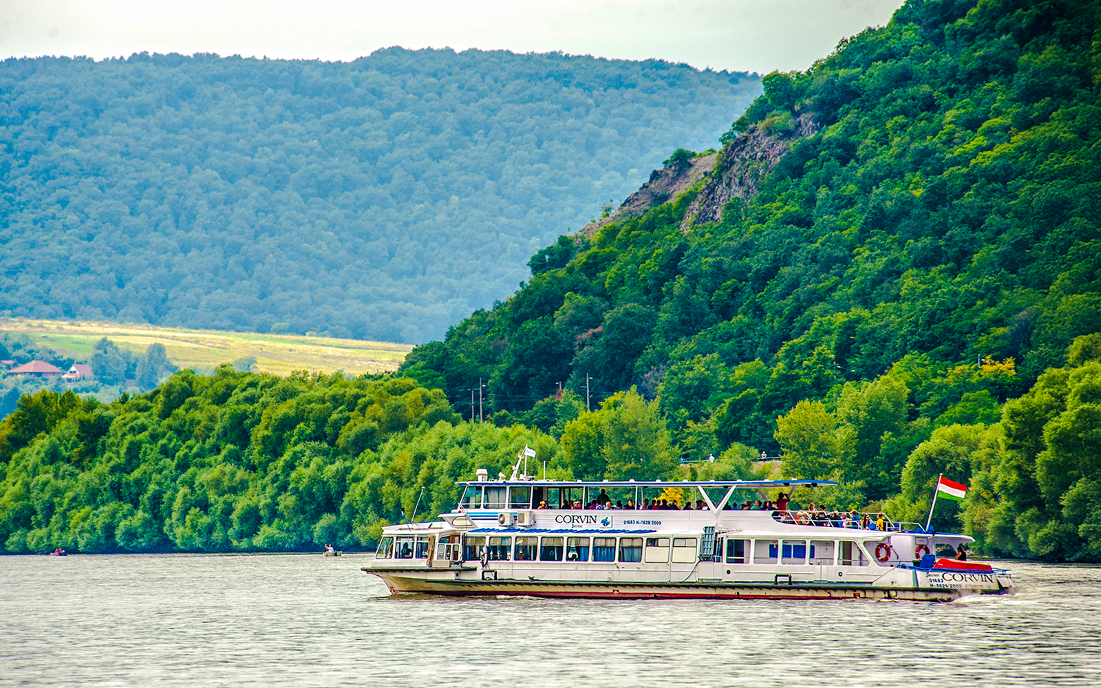 Boat cruising on the Danube River during Full Day Visegrád Cruise with Medieval Show & Banquet.