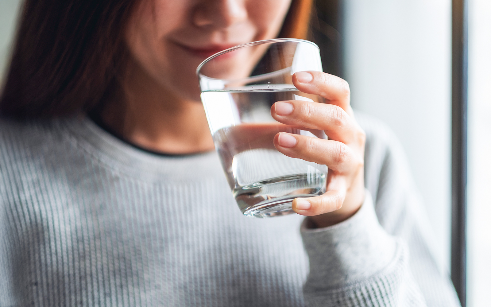 Woman drinking a glass of water