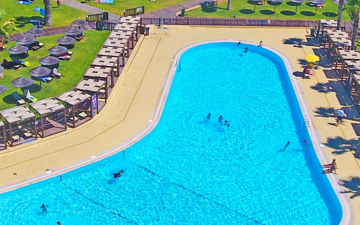 Aerial view of swimming pool and sun loungers at Zoomarine Algarve.