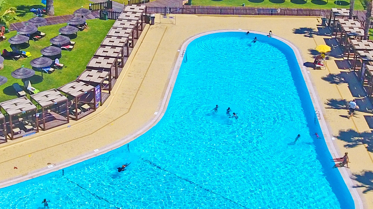 Aerial view of Zoomarine Algarve showcasing water park attractions and dolphin pools in Portugal.