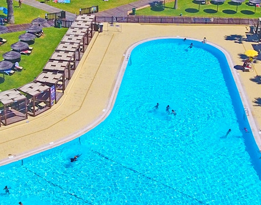 Aerial view of Zoomarine Algarve showcasing water park attractions and dolphin pools in Portugal.