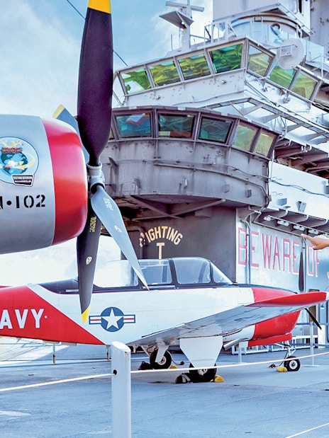 Father and daughter viewing aircraft at Intrepid Museum, New York City.