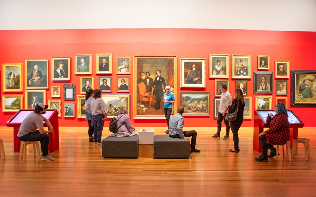 Visitors viewing portrait gallery at Museum of NZ Te Papa Tongarewa.